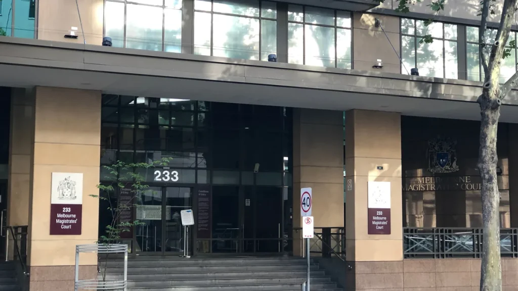 The entrance of the Melbourne Magistrates' Court on William Street, showing the 233 address and court signage.